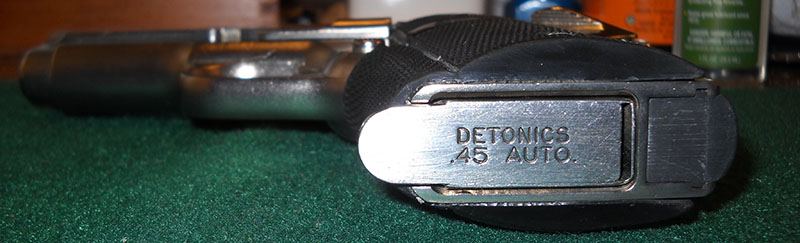 DCM Mk II from beneath, showing DETONICS .45 AUTO stamp on magazine floorplate